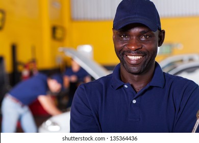 close up portrait of happy african male auto mechanic