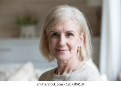 Close Up Portrait Of Happy Aged Beautiful Female Looking At Camera Relaxing At Home, Smiling Senior Woman Posing For Picture Or Photo, Elderly Lady Feeling Positive Shoot For Album In Country House