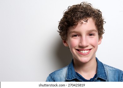 Close Up Portrait Of A Happy Boy Smiling On White Background