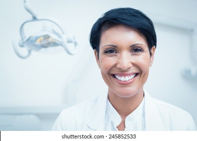 Close Up Portrait Of Happy Confident Female Dentist