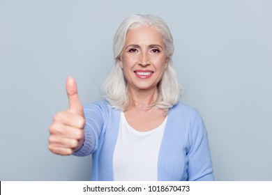 Close Up Portrait Of Happy Joyful Confident Satisfied With Shiny Beaming Smile Mature Woman Grandmother Granny Grandma With Gray Hair, She Is Showing Thumb-up, Isolated On Gray Background