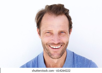 Close Up Portrait Of Happy Older Man Smiling Against White Background 