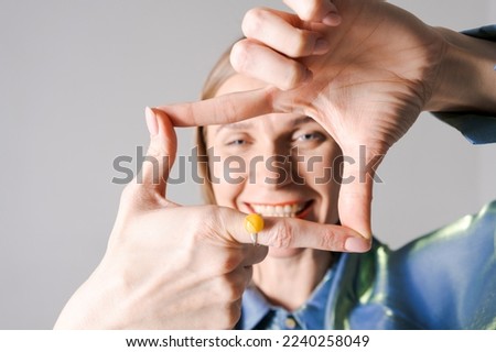 Similar – Crop unrecognizable teenage girl eating healthy walnut kernel