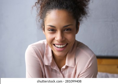 Close Up Portrait Of A Happy Young African American Woman Laughing