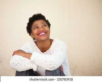 Close Up Portrait Of A Happy Young Black Woman Smiling And Looking Up