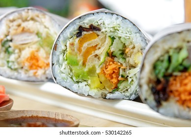 close up portrait of japanese sushi burrito roll served with wasabi