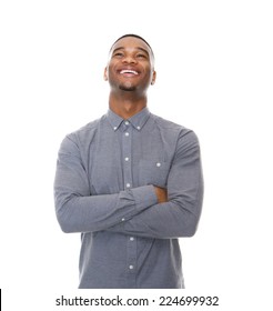 Close Up Portrait Of A Laughing Young Black Man With Arms Crossed On Isolated White Background