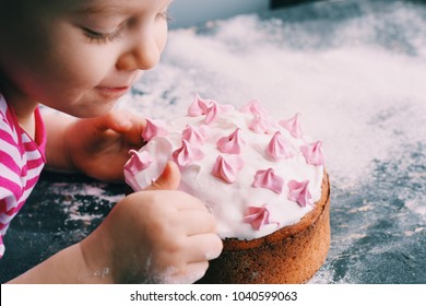 Close up portrait of little girl making Easter cake. Little girl with a cake. Easter concept. - Powered by Shutterstock