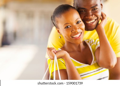 close up portrait of lovely african couple embracing