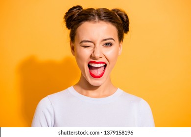 Close up portrait of lovely cute funny lady making winks opening her mouth shouting yeah having holidays dressed in white comfortable clothing isolated on bright background - Shutterstock ID 1379158196