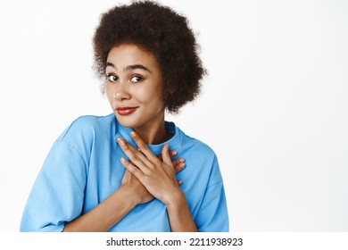 Close Up Portrait Of Lovely, Tender African Girl With Clear, Healthy Natural Facial Skin Without Makeup Or Blemishes, Smiling Cute, Standing In Blue Tshirt Over White Background