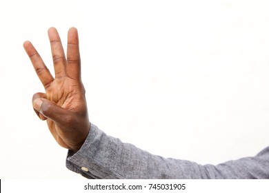 Close Up Portrait Of Male Hand With Three Fingers Count Sign On White Background