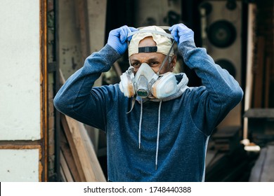 Close Up Portrait Of Male Worker Wearing Full Face Respirator Mask For Working In Hazard Environment. 