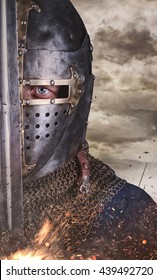 Close Up Portrait Of A Man In Knight Helmet.