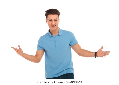 Close Portrait Of Man Posing In Isolated Studio Background With Arms Wide Open While Looking At The Camera