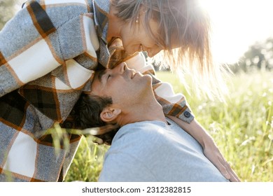 Close up portrait man and woman laughing together.Romantic affectionate couple on a holiday.Couple embracing and smiling. Sunset sunshine . - Powered by Shutterstock