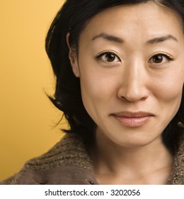 Close Up Portrait Of Mid Adult Asian Woman.