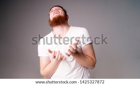 Close Up portrait miserable upset man, looking very sick isolated grey wall background. Negative facial expression emotion feeling health issues concept