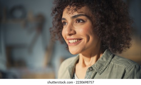 Close Up Portrait of a Multiethnic Brunette with Curly Hair and Brown Eyes. Happy Creative Young Woman Charmingly Smiling and Feeling Joyful. Thinking Up Ideas About Greater Future.