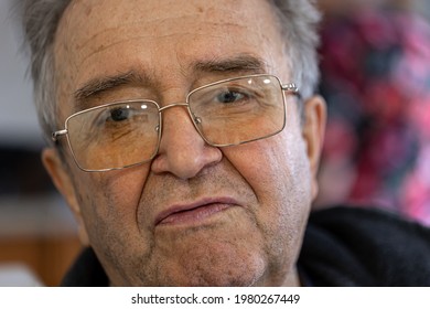 Close Up Portrait Of An Old Man With A Sad Look.