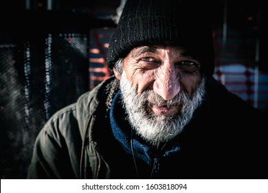 Close Up Portrait Old Smiling Homeless Alcoholic Man Face With White Beard And Hair Wandering On The Street Depressed Sick And Lonely On Cold Winter Day Social Issues Homelessness Documentary Concept