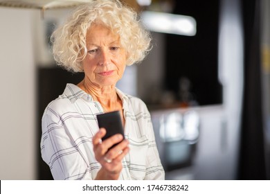 Close Up Portrait Older Woman Looking At Mobile Phone Screen 