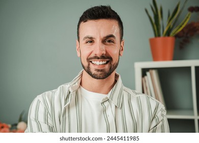 Close up portrait of one handsome guy with perfect white teeth smiling at home. Front view of young confident man with friendly and positive expression. Happy adult male laughing and looking at camera - Powered by Shutterstock