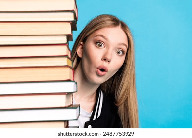 Close up portrait of pretty lovely clever diligent girl wear stylish clothes peek out book bookstore sale isolated on blue color background - Powered by Shutterstock