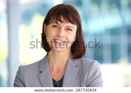 Close up portrait of a professional business woman smiling outdoor