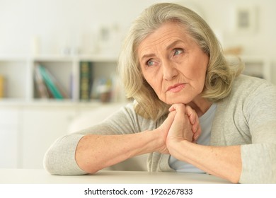 Close Up Portrait Of Sad Senior Woman Posing At Home