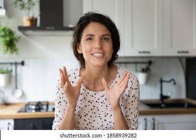 Close up portrait screen view of motivated young Caucasian woman talk speak on video call at home kitchen. Happy excited female teacher coach record webinar, have webcam conference or virtual meeting. - Shutterstock ID 1858939282