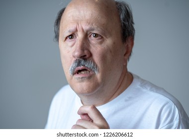 Close up portrait of senior man looking confused and lost suffering from dementia, memory loss or Alzheimer in Mental health in Older Adults and later life concept isolated on grey background. - Shutterstock ID 1226206612