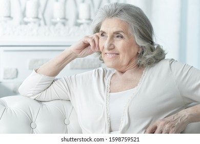 Close up portrait of senior woman posing at home - Shutterstock ID 1598759521