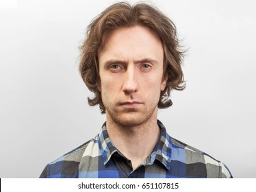 Close Up Portrait Of Serious Man Isolated On Studio Background