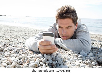 Close Up Portrait Of A Smart Man Using A 