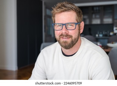 Close up portrait of smiling 30s Caucasian man look at camera posing in own flat or apartment. Profile picture of happy 30s male renter or tenant in new home. Real estate, rental concept.