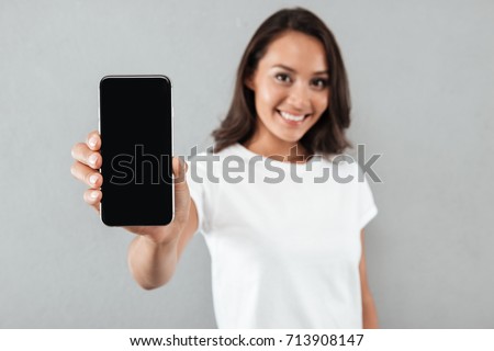 Similar – Image, Stock Photo Beautiful woman holding a DC CCS2 EV charging connector on a Hypercharger or Supercharger for recharge her car.