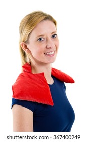 Close Up Portrait Of Smiling Blond Woman Relaxing With Red Heat Or Cold Pack On Shoulders In Studio With White Background