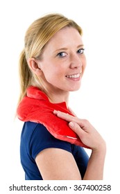 Close Up Portrait Of Smiling Blond Woman Relaxing With Red Heat Or Cold Pack On Shoulders In Studio With White Background