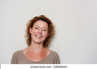 Close Up Portrait Of Smiling Brunette Woman On White Background