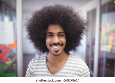 Close up portrait of smiling businessman with frizzy hair - Powered by Shutterstock