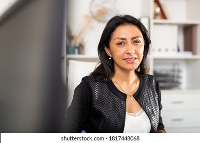 Close up portrait of smiling confident hispanic female office employee .. - Shutterstock ID 1817448068