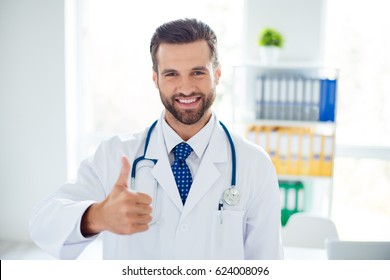 Close Up Portrait Of Smiling Doctor Recommending The New Way Of Treatment By Showing Thumb Up