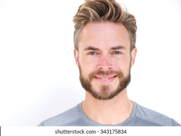 Close Up Portrait Of A Smiling Man With Beard Posing Against Isolated White Background 