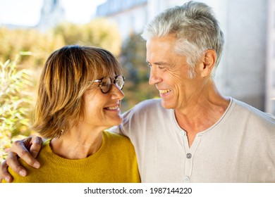 Close Up Portrait Smiling Older Couple Looking At Each Other 