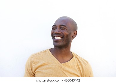 Close Up Portrait Of Smiling Young African Man Against White Background