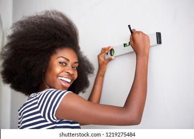 Close Up Portrait Of Smiling Young Black Woman Doing Diy At Home