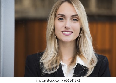 Close Up Portrait Of A Smiling Young Business Woman Executive