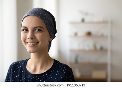 Close Up Portrait Of Smiling Young Caucasian Woman Struggle With Oncology Wear Scarf On Bald Hairless Head. Happy Millennial Female Cancer Patient Feel Optimistic, Hope For Recovery Or Remission.