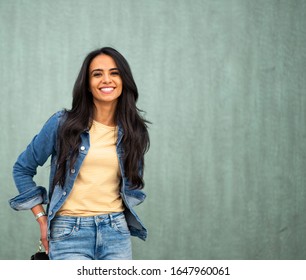 Close Up Portrait Smiling Young North African Woman Posing By Green Wall